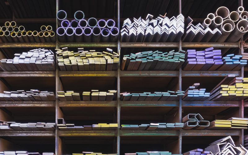 many-different-steel-bars-and-tubes-on-storage-she-2023-11-27-05-03-49-utc-min